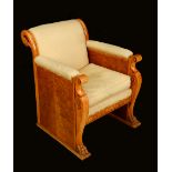 A Biedermeir walnut armchair, scroll back carved with swans, stuffed over upholstery, squab cushion,