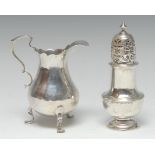 An early George III silver bellied cream jug, acanthus-capped double-scroll handle, shaped pad feet,