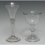 A George II trumpet shaped wine glass, drawn stem with tear inclusion, spreading circular foot, 18.
