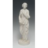A Belleek Parian figure, Affection, she stands scantily draped, holding her necklace, circular base,