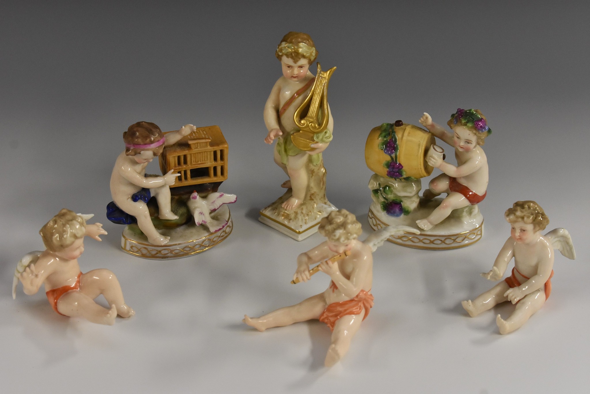 A set of three Meissen frolicking cherubs;