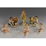 A set of three Meissen frolicking cherubs;