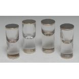 A set of four Edwardian silver mounted clear glass cylindrical condiment shakers, 10.