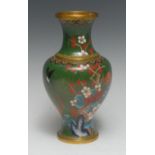 A Japanese cloisonné vase, enamelled with peonies and other foliage on a green ground, 23.