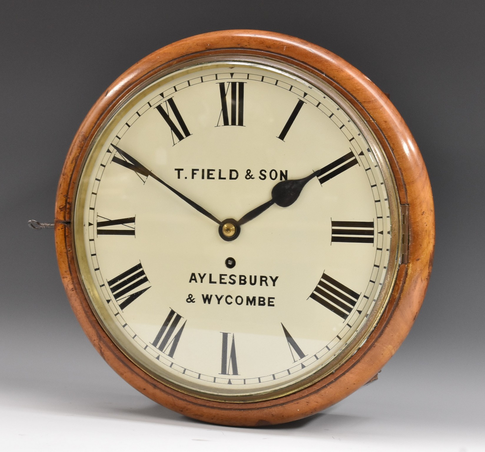 A 19th century mahogany wall clock, 30cm diam, Roman numerals, inscribed T.
