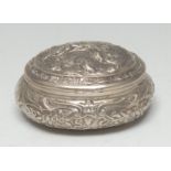 A Dutch silver oval snuff box, hinged cover chased with putti, the side with flowers and scrolls,