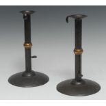 A pair of early 19th century sheet iron hog scraper ejector candlesticks,