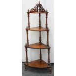 A Victorian walnut and mahogany four-tier corner whatnot,