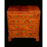 A George I walnut caddy top bachelors chest,