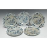 A set of five Chinese circular plates, decorated in underglaze blue with pagoda, huts,