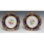 A fine pair of Royal Crown Derby shaped circular plates, painted by Cuthbert Gresley,