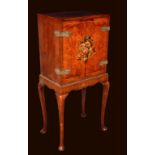 A Queen Anne Revival painted walnut cabinet on stand,