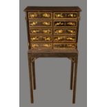 A 19th century Japanned cabinet on stand,