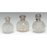 An Edwardian silver mounted hobnail-cut globular scent bottle,