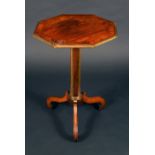 A Regency brass mounted rosewood pedestal centre table, crossbanded octagonal top,