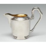 A Russian silver cream jug, shaped scroll handle terminating in acanthus, pierced foot,