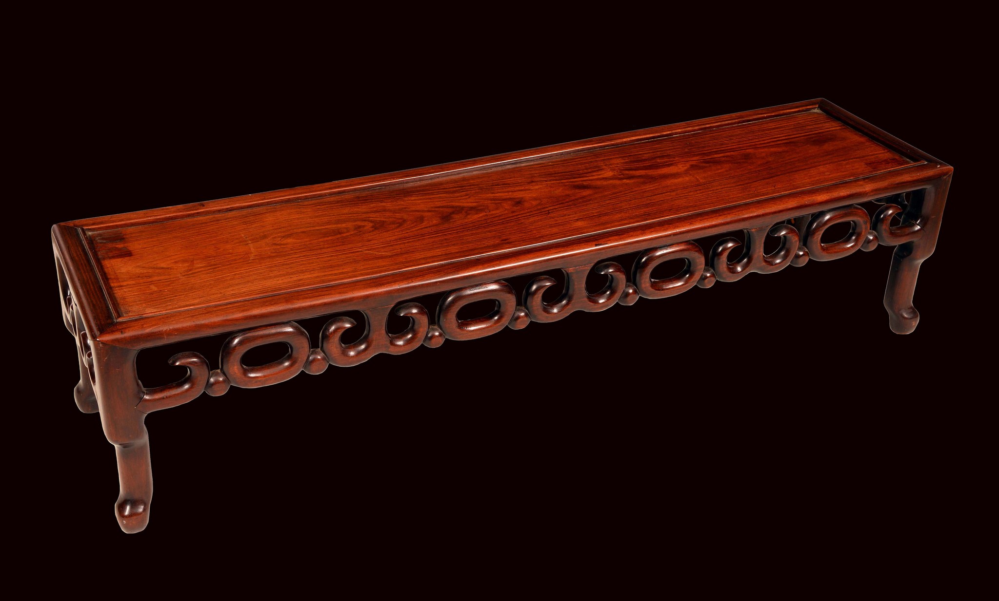 A Chinese hardwood rectangular low scholars table, rectangular panel top, above a deep frieze,