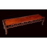 A Chinese hardwood rectangular low scholars table, rectangular panel top, above a deep frieze,