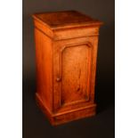 A Victorian burr walnut pot cupboard, moulded top above a canted rectangular panel door,