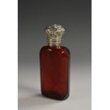 A 19th century silver coloured metal mounted ruby glass scent bottle,