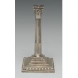 A George III silver stop-fluted Corinthian column taper stick, stepped square base, ovolo borders,
