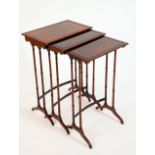 A Regency rosewood nest of three occasional tables, rectangular tops, turned twin-pillar supports,