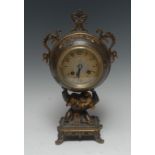 A 19th century French Japonesque brown and gilt-patinated bronze clock,
