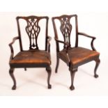 A pair of Chippendale Revival mahogany elbow chairs,
