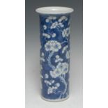 A Chinese porcelain cylinder sleeve vase, painted in underglaze blue with cherry blossom, 25.