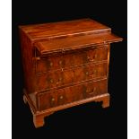 A George III mahogany caddy top bachelors chest,