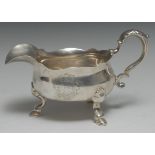 A substantial George II silver boat, acanthus-capped scroll handle, hoof feet, 20cm long,