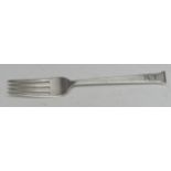 Omar Ramsden - an Arts and Crafts fork, seal-top finial, planished overall, 17.