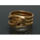 A Gentleman's Snake signet ring coiled triple loop shank, crossed head and tail, peridot eyes,