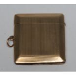 A 9ct gold rounded rectangular vesta, engine turned, Chester 1917,