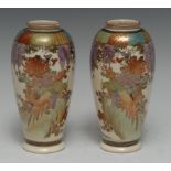 A pair of Japanese Satsuma ovoid vases, decorated overall with fanciful birds and wisteria, 15.