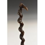 A 19th century novelty 'hedgerow folk art' walking stick, the pommel as the head of a stylised bird,