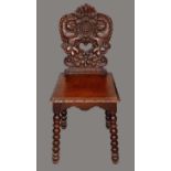 A 19th century Continental side chair, shaped back carved with rampant lions, shells and buds,