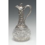 A Victorian silver and hobnail-cut clear glass claret jug, profusely embossed with fruiting vine,