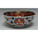 A Japanese Imari porcelain flared circular bowl, typically decorated underglaze and onglaze,
