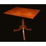 A 19th century mahogany tripod supper table, rounded rectangular top, turned pillar,