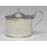 A George III silver oval mustard, hinged domed cover, reeded scroll handle and borders,