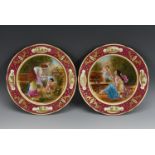 A pair of Austrian cabinet plates, printed and painted with classical ladies and cherubs,