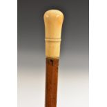 An early 18th century gentleman's ivory and malacca walking stick,