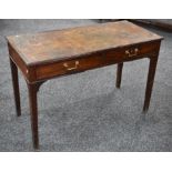 A George III mahogany writing table, reeded rectangular top with inset leather writing surface,