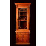 A late Victorian mahogany pier bookcase, in the manner of Howard & Sons,