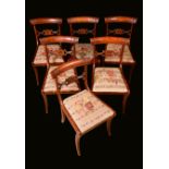 A set of six George IV rosewood dining chairs, curved bar backs,