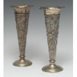 A pair of Art Nouveau silver trumpet shaped mantel vases, wavy rims, each embossed with irises,
