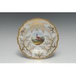 A Flight Barr & Barr shaped circular dish, painted to centre by Davis with an exotic bird,