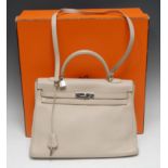 Luxury Fashion - a Hermes lady's cream leather Kelly handbag, textured overall, marked Hermes-Paris,