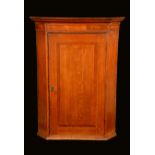 A George III oak corner cupboard,